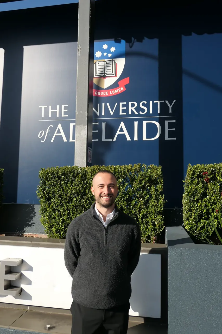 Jeremy Smolicz outside The University of Adelaide, where he graduated and now guest lectures